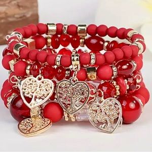 NWT 4 piece bracelet set with red beads and hearts